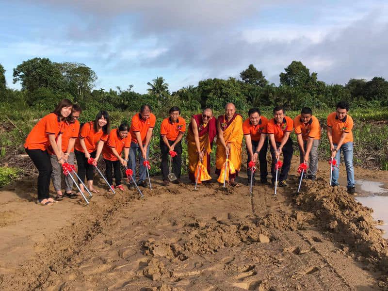 Community members and spiritual leaders at the monastery groundbreaking ceremony
